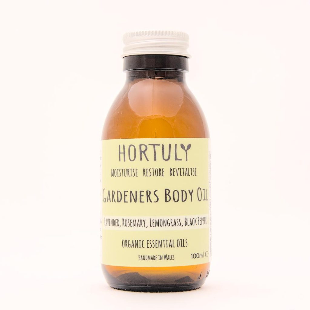 Natural, organic, Vegan skincare. Hortuly organic gardeners skincare body oil contained in an amber bottle with aluminium lid. 