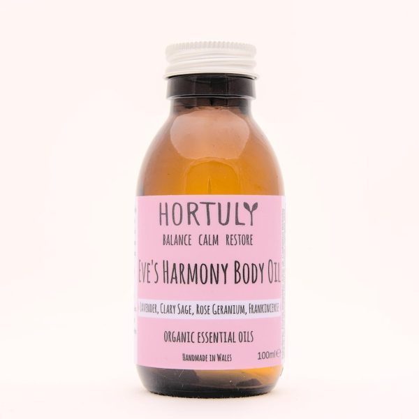 Bottle of Eve's Harmony body oil in an amber glass bottle with a silver aluminium cap.