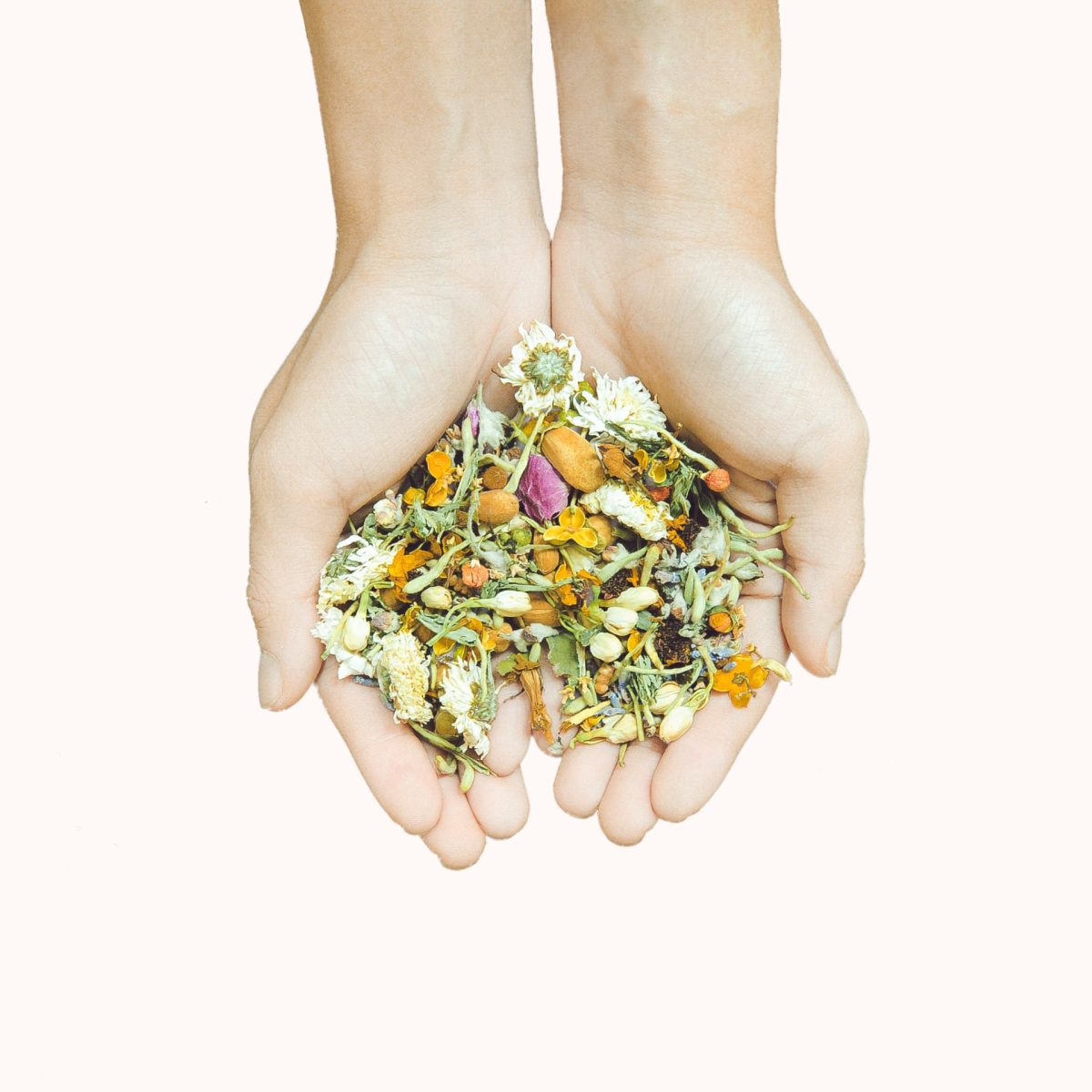 Hands and dried flowers.