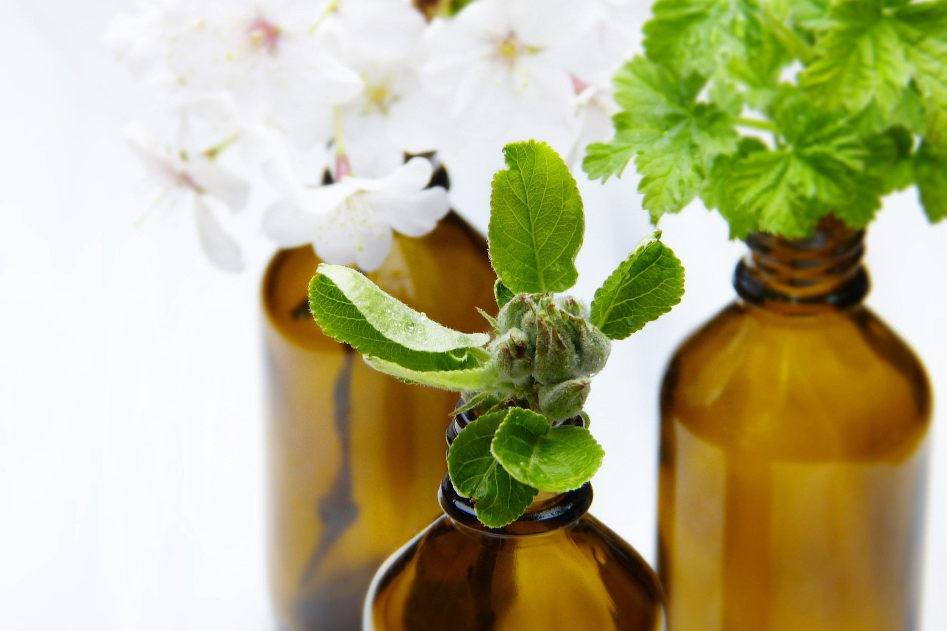 Hortuly Gardeners Body Oil in amber glass jar with aluminium lid and Soy Wax aromatherapy candle in clear glass jar with aluminium lid.